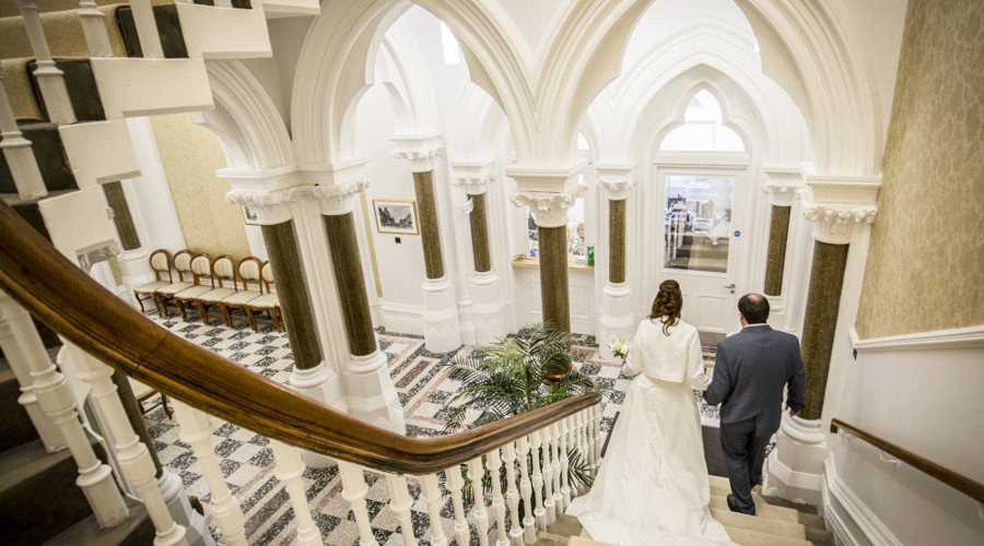 A happy couple on the Register Office stairs