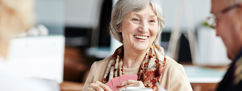 Older people playing cards together