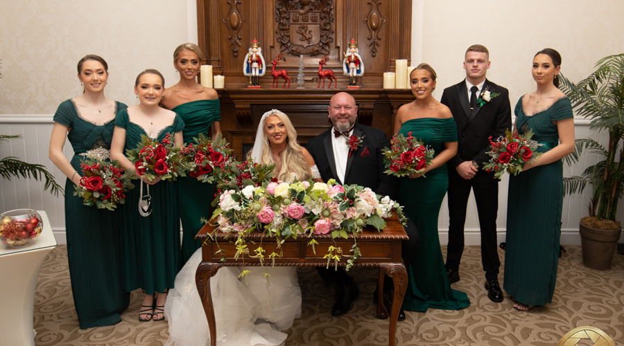 A happy couple in front of the historic fireplace