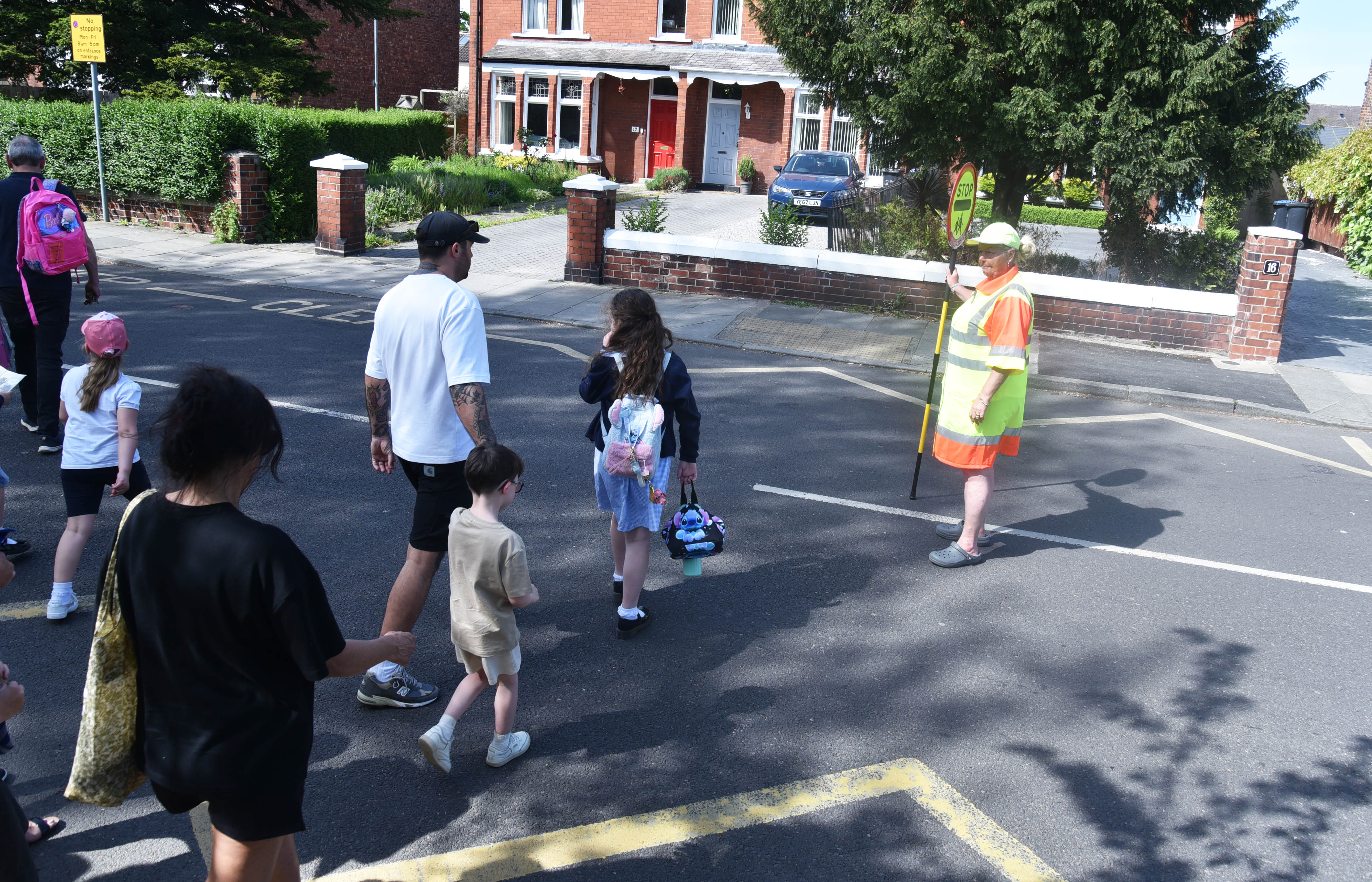 Children with a school crossing patrol officer on Eastbourne Road in Middlesbrough