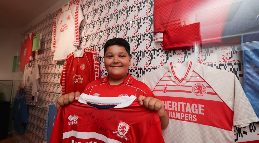 A young fan enjoys the collection at the Boro Shirt Museum