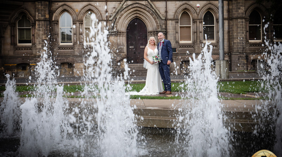 A happy couple beside the Centre Square fountain