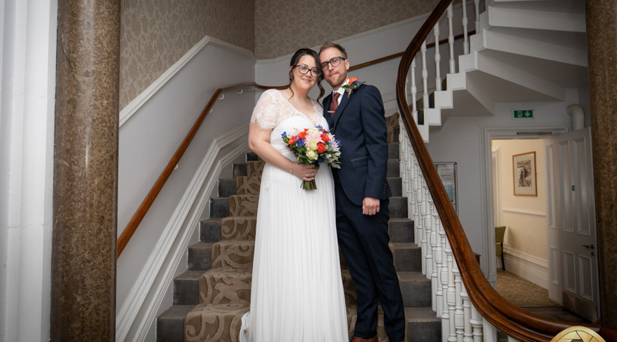 A happy couple on the Register Office stairs